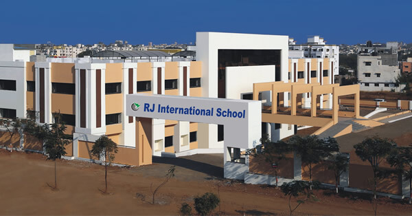 R J International School